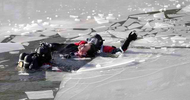 woman saved by diver from icy river